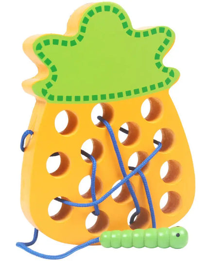 Practicing ability to thread intellectual wooden toys - Pineapple